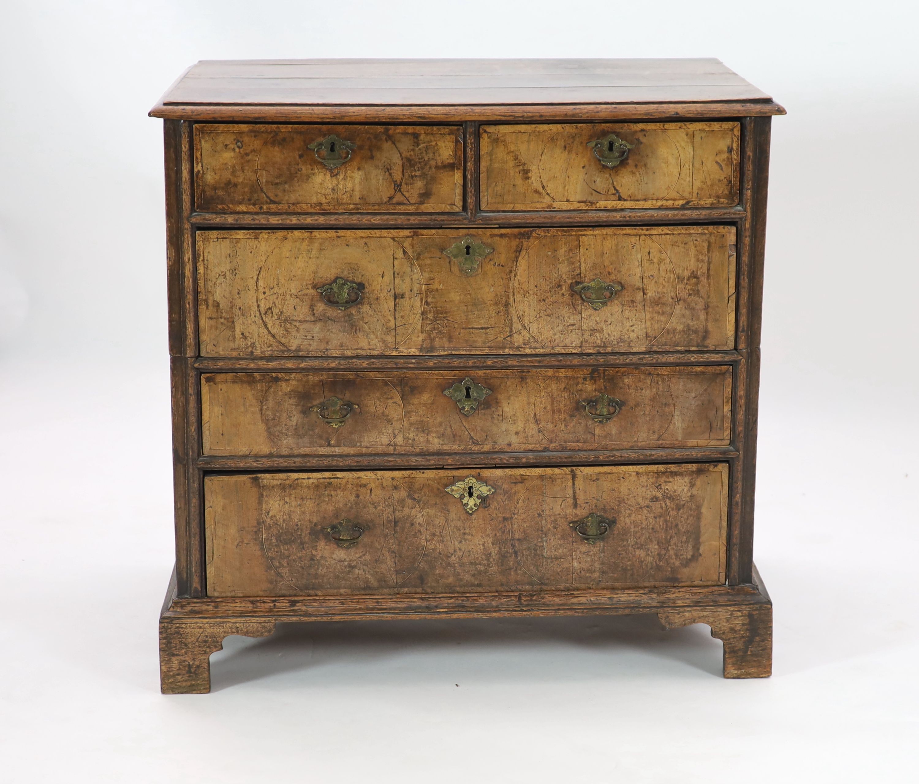 An early 18th century oak and walnut chest, W.94cm D.61cm H.91cm
